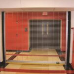 W-CD-600-EES-Grille-OrangeBlack-SchoolHallway.jpg